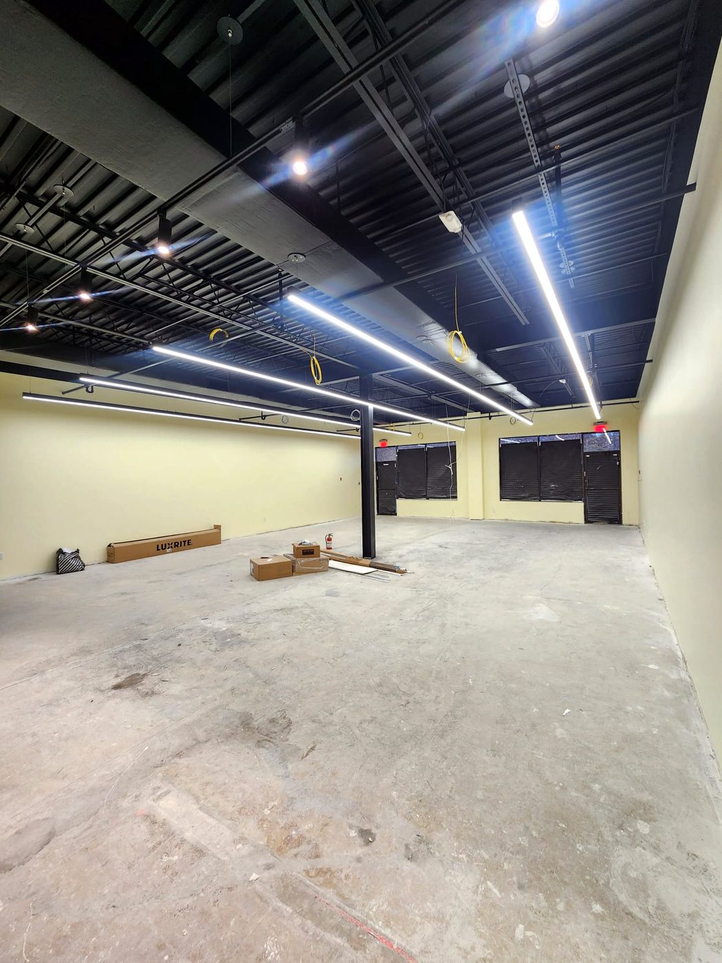 Linear LED fixtures installed in an empty commercial space