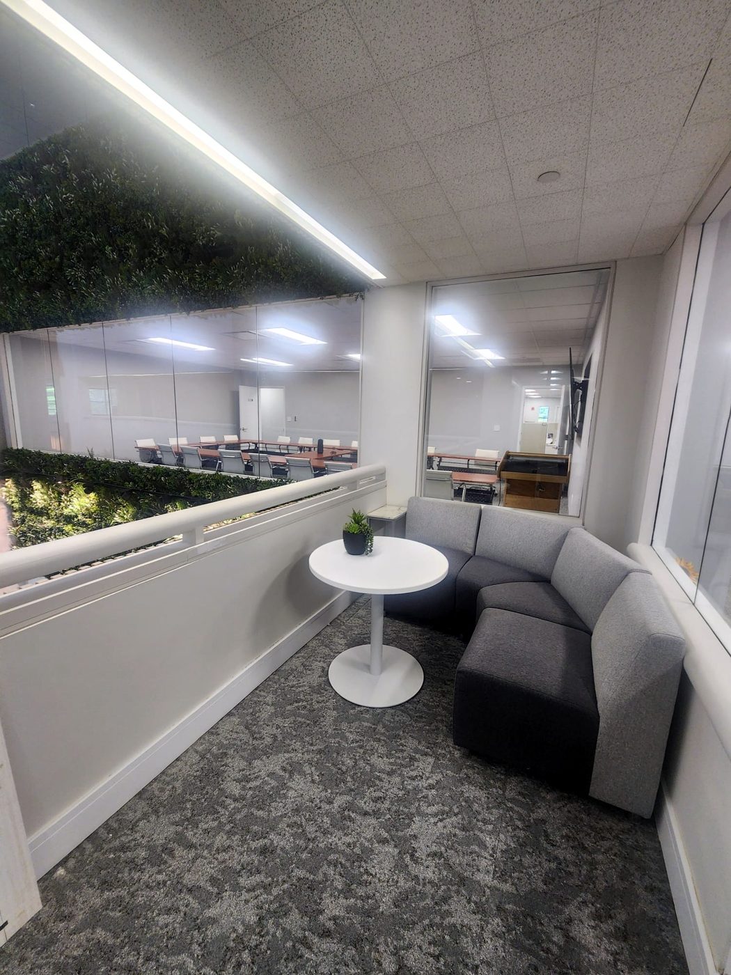 Finished commercial office lounge with linear LED lighting