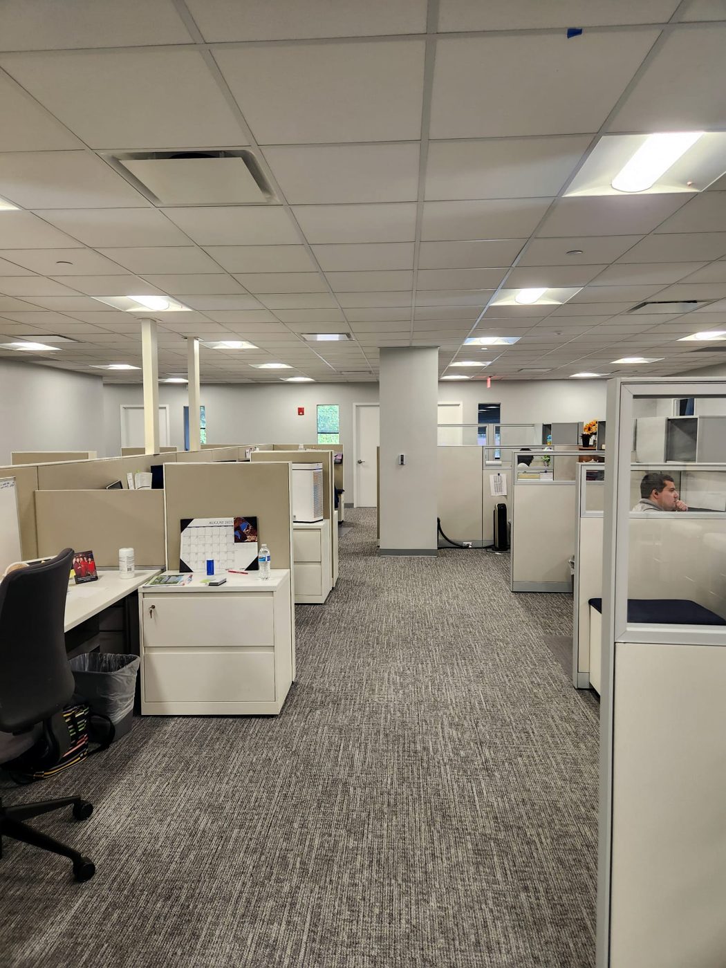 Finished open office with cubicles and new lighting