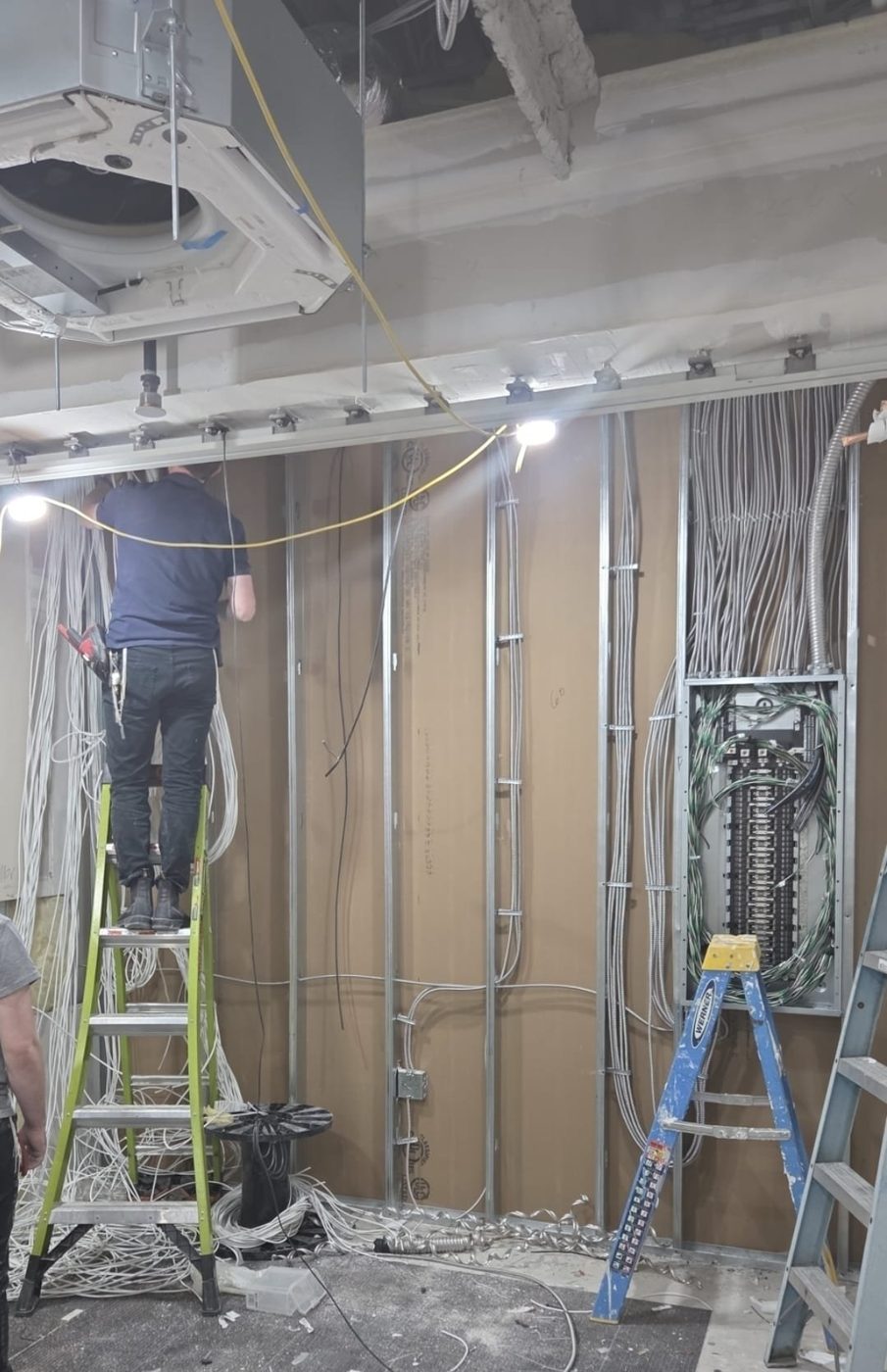 Panel and branch circuit wiring during rough-in behind open studs